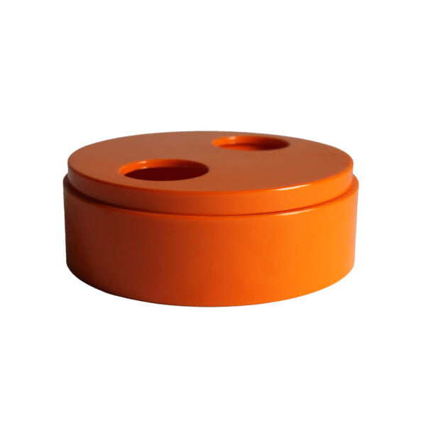 Round orange lidded melamine trinket bowl by Sergio Asti for Bilumen, the bottom has two teardrop shaped holes. The top twists to make the holes more or less shallow | Century Soup |
