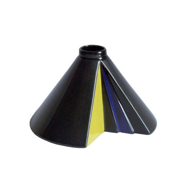A conical ceramic vase missing a slice, designed by Steuler Keramik (1917 – 1996). Shaped like a cone with a slice taken out to create a hollow inside which has been decorated in yellow, blue and black triangles. The outer glaze which seems black or dark grey from far away, reveals a very postmodern Memphis-group like bacteria shaped glossy finish when you look closer. Century soup vintage design antiques curiosa collectibles antwerp.