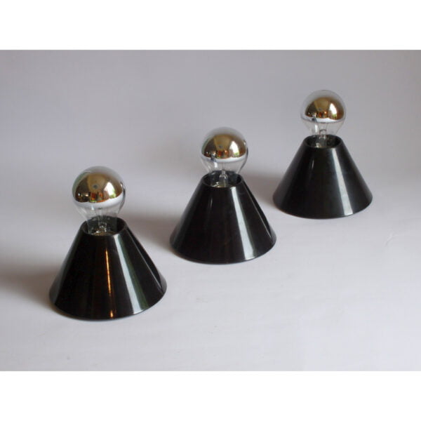 A set of three model "Jolly" ceiling or wall lights designed by Bruno Celupica for Tronconi, Italy. 1970s. Minimalistic black conical shaped wall mounts. Century soup vintage design antiques curiosa collectibles antwerp.