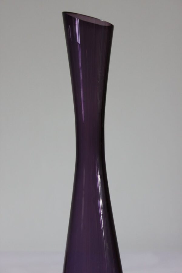 A purple glass soliflore or "single flower vase" with an angular cut spout. By Gunnar Ander for Elme Glasbruk, Sweden 1960s.