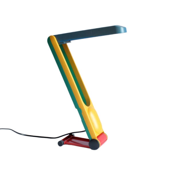 A very very 1980s desk or table lamp in primary green, blue, yellow and red colors. It can be adjusted in height and it can be folded. Century soup vintage design antiques curiosa collectibles antwerp.