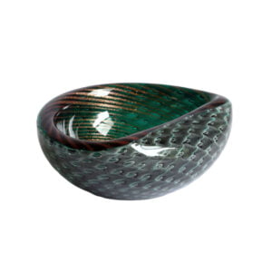 A gold flecked striped green bullicante and filigrana technique bowl, murano 1950. Filigree glass is made with colorless, white, and sometimes colored canes. Filigrana originated on the island of Murano in the 16th century and continued until the 18th century. It saw a revival in the 19th century. The bullicante technique inserts layers of bubbles into the glass in a grid pattern | Century Soup |