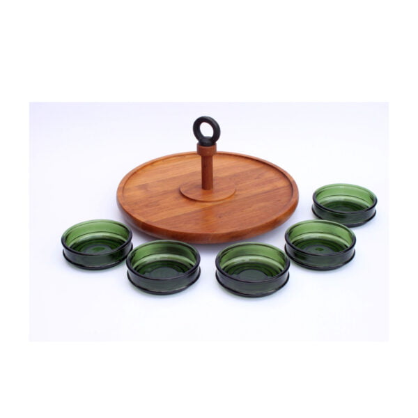 Teak wooden "lazy susan" serving tray with five green glass bowls. Designed by richard nissen, denmark 1960s. Round wooden Scandinavian snack or sauce serving set with a castiron handle that holds five green bowls. It rotates hence the name "lazy susan", you can bring the sauce or snack to your side without getting up from your chair or having to pass the bowl. Century soup vintage design antiques curiosa collectibles antwerp.