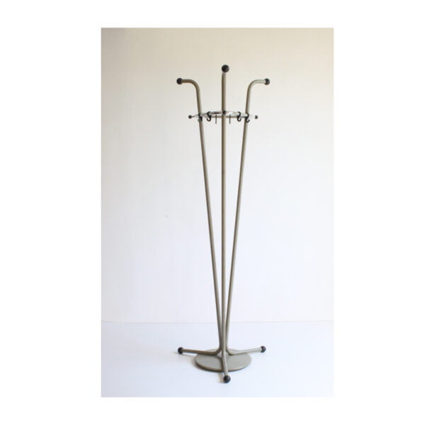 Three tall bent steel tubes with a chrome triangle top that holds the hooks. Tubular coat rack by Tubax