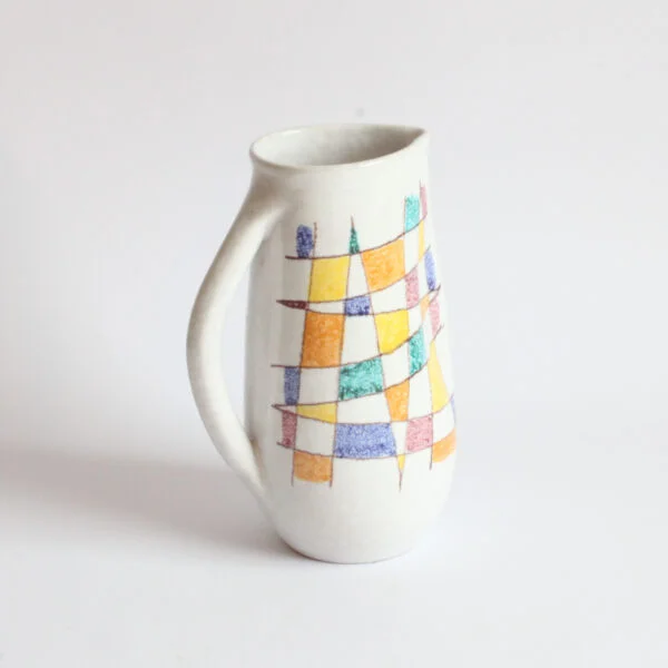 A vintage mid century white ceramic pitcher by Aldo Aondi for Bitossi, Italy 1960s. White glazing decorated with an abstract color grid in green, yellow, blue and bordeaux | Century Soup |