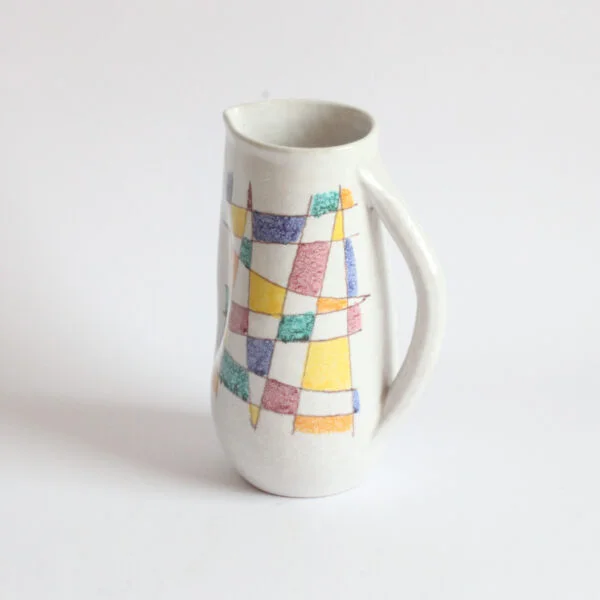 A vintage mid century white ceramic pitcher by Aldo Aondi for Bitossi, Italy 1960s. White glazing decorated with an abstract color grid in green, yellow, blue and bordeaux | Century Soup |