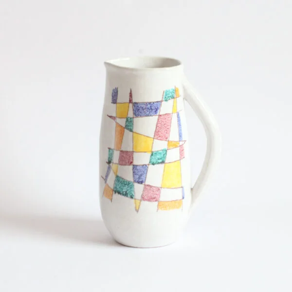 A vintage mid century white ceramic pitcher by Aldo Aondi for Bitossi, Italy 1960s. White glazing decorated with an abstract color grid in green, yellow, blue and bordeaux | Century Soup |