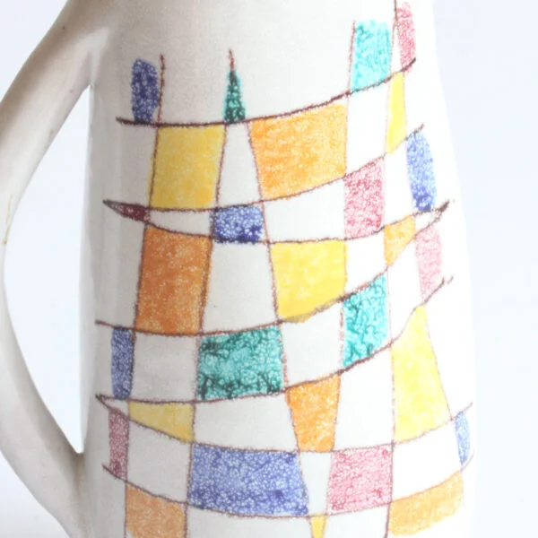 A vintage mid century white ceramic pitcher by Aldo Aondi for Bitossi, Italy 1960s. White glazing decorated with an abstract color grid in green, yellow, blue and bordeaux | Century Soup |