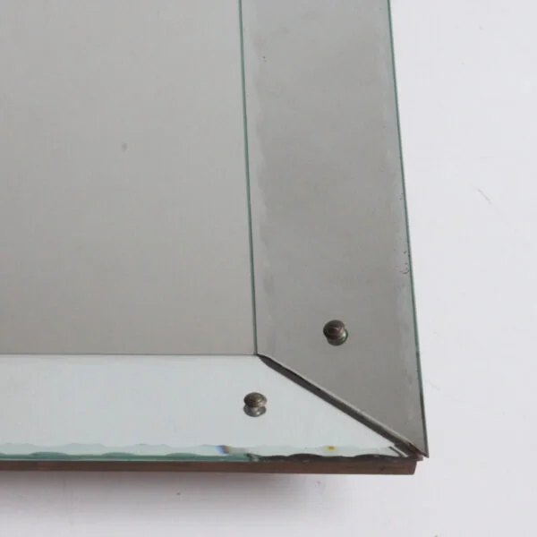 Art deco classic picture frame style shadow box mirror with scalloped edges. The frame is made of mirrored glass at an angle, creating a depth.