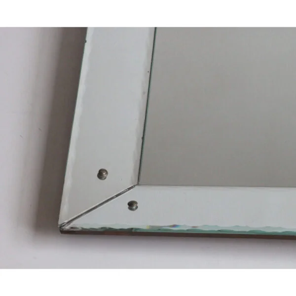 Art deco classic picture frame style shadow box mirror with scalloped edges. The frame is made of mirrored glass at an angle, creating a depth.