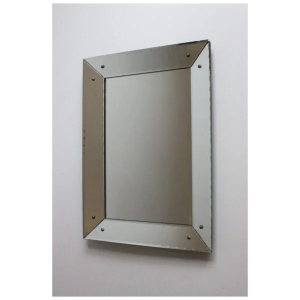 Art deco classic picture frame style shadow box mirror with scalloped edges. The frame is made of mirrored glass at an angle, creating a depth.