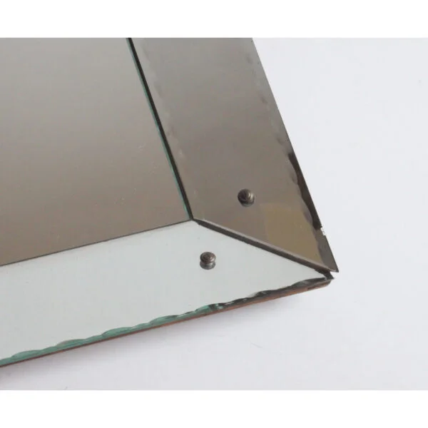 Art deco classic picture frame style shadow box mirror with scalloped edges. The frame is made of mirrored glass at an angle, creating a depth.