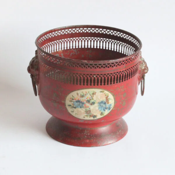 A painted toleware pedestal jardiniere with dog handles and a flower decor, france early 20th century. Cylindrical body on a pedestal, the rim is punctured to resemble archways and columns | Century Soup |