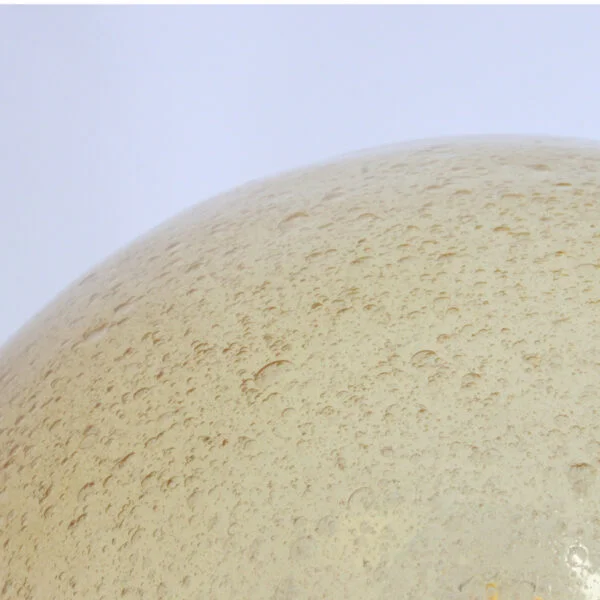 A bubble glas or "Pulegoso" technique wall or ceiling lamp by Glashütte Limburg, Germany 1970s. The shade is blown in a mushroom shape, and sits on a round brass base. The bulb is held inside on a reclining brass cone.