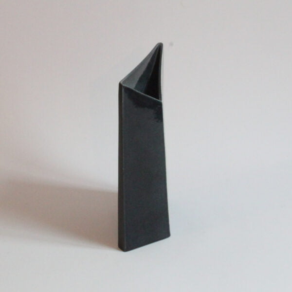 An abstract black ceramic vase with white silhouette lines, resembling a letter. From the "Ikebama" series by Tom Bruinsma for Mobach | Century Soup |