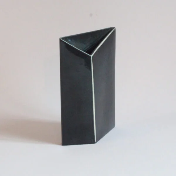 An abstract black ceramic vase with white silhouette lines, resembling a letter. From the "Ikebama" series by Tom Bruinsma for Mobach | Century Soup |