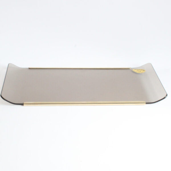 1970s curved smoked glass serving tray with brass edges, the glass curves upwards to serve as handles. This hollywood Regency style Italian tray is designed and manufactured by Umberto Mascagni | Century Soup |