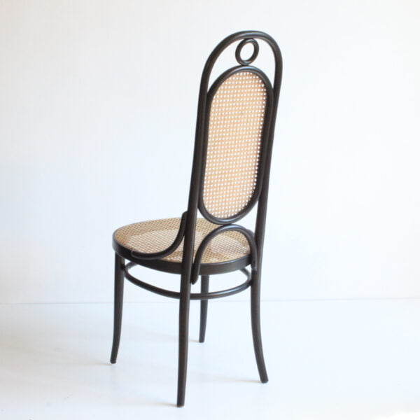 A set of 2 bent wooden chairs with cane seats and backrests in a black lacquered high back frame. Model long john 207r. A 1970s thonet re-edition of the 1860s model number 17 designed by michael thonet. Marked thonet and label underneath | Century Soup |