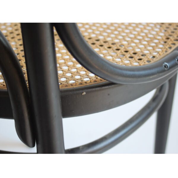 A set of 2 bent wooden chairs with cane seats and backrests in a black lacquered high back frame. Model long john 207r. A 1970s thonet re-edition of the 1860s model number 17 designed by michael thonet. Marked thonet and label underneath | Century Soup |