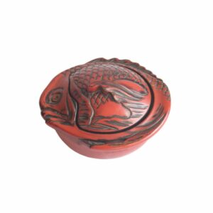Takaoka Shikki lacquerware seabream bonbonniere box, Japan 1920s An early 20th Century red Takaoka Lacquerware Kashibako lidded bonbonniere, confectionery box or sweets jar in the shape of a Sea Bream fish. The sap is harvested from the Urushi tree. Shikki is also often referred to as “nurimono”, or painted things. Typically lacquer is applied to a wooden core with multiple layers of coating. There are a number of techniques of application and decoration. Takaoka Shikki exists over 400 years. Tradition has it that Takaoka- shikki lacquerware was first produced when Oba Shozaemon, who moved to the castle town, coated the furniture he made with lacquer. This was followed by wardrobes and nagamochi (large oblong chests for storing garments and household goods) and eventually tableware, kitchen utensils and other items for everyday use. Takaoka lacquerware offers a wide range of reliable products backed by tradition, and was designated a traditional craft in 1975. Century Soup vintage design antiques collectibles and curiosa antwerp.