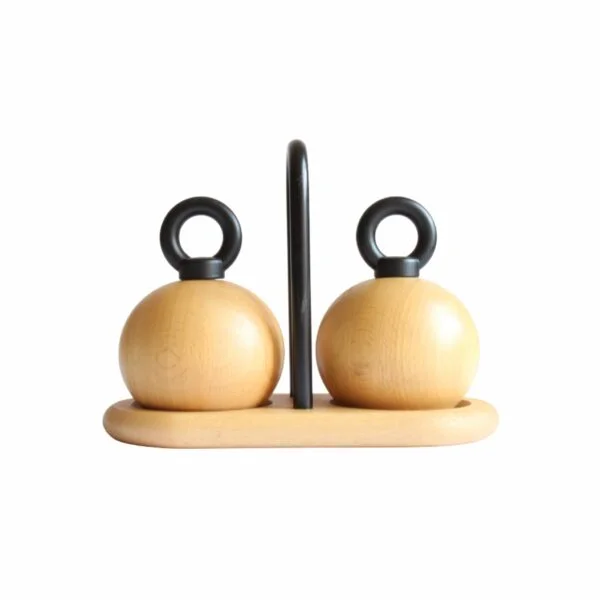 A set of pepper and salt mills / grinders designed by Richard Nissen & Carsten Jørgensen for Bodum, Denmark. The round beech wooden bodies with and castiron O-ring shaped handles. A beech wooden tray with a castiron handle serves as the base of the vintage condiment set | Century Soup |