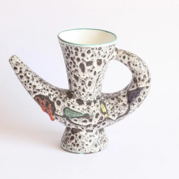 A very 1950s vintage organic shaped vase or pitcher by Marius Bessone, Vallauris 1950s. In a white / black lava glaze with geometric figures in green, red, yellow and blue mid century modern | Century Soup |
