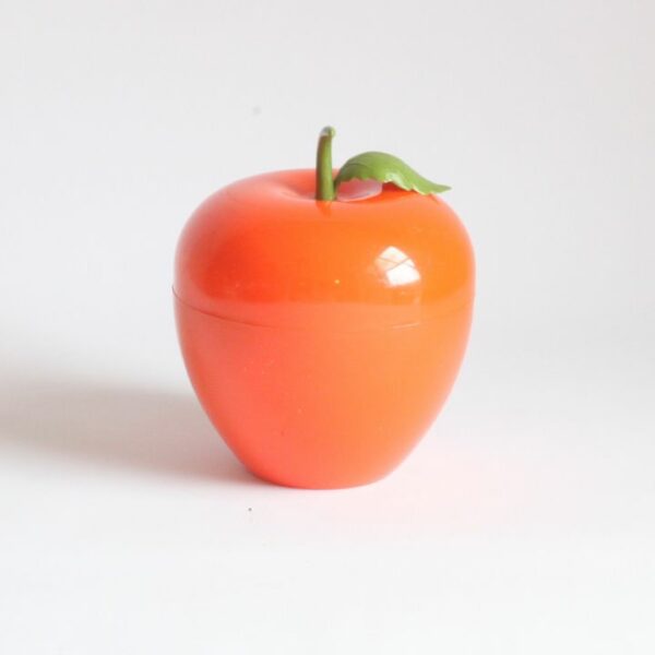 A vintage orange insulated plastic ice bucket in the shape of an apple with a green stem. The 1970s design ice cooler has an orange shell and white interior. Marked underneath: SOMM Paris. Century soup vintage design antiques curiosa collectibles antwerp.