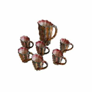 Crazy colorful ceramic pitcher and mugs, Vallauris 1960s A set of six crazy colorful mugs and a pitchers in Vallauris ceramics, 1960s-1970s. Naturalistic shape where body resembles tree bark, and the handle swings back like a branch. The inside rim resembles a shell.