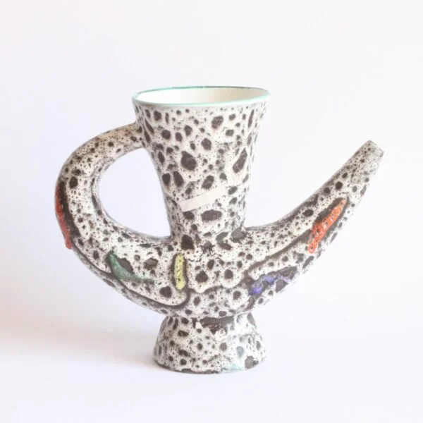 A very 1950s vintage organic shaped vase or pitcher by Marius Bessone, Vallauris 1950s. In a white / black lava glaze with geometric figures in green, red, yellow and blue mid century modern | Century Soup |