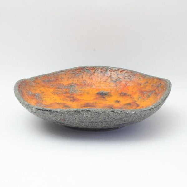 Rough vintage 1960s stoneware bowl with an orange lava glaze by Jan van Erp, The Netherlands 1960s. Large art ceramic centrepiece bowl has an orange lava glaze interior with a rough stoneware base. Can be used as a fruit bowl, a vide-poche or keychain bowl or as a centrepiece platter | Century Soup |