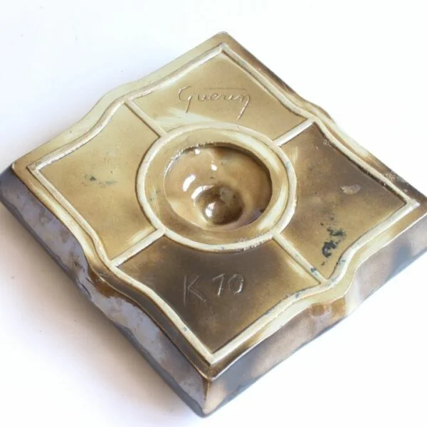 Vintage art deco square stoneware ashtray in gres de guerin with blue gemstones in the corners crackle glass inlays in blue, green and yellow. In the middle sits a large purple ceramic "gemstone". Very medieval magical forest fairy tale vibes. Century Soup vintage design.
