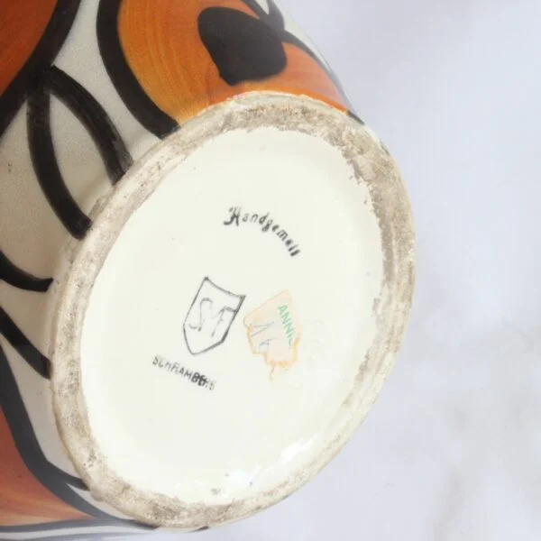 A Schramberg majolica vase, hand painted in black, orange and white floral decor. Attributed to Eva Zeisel | Century Soup |