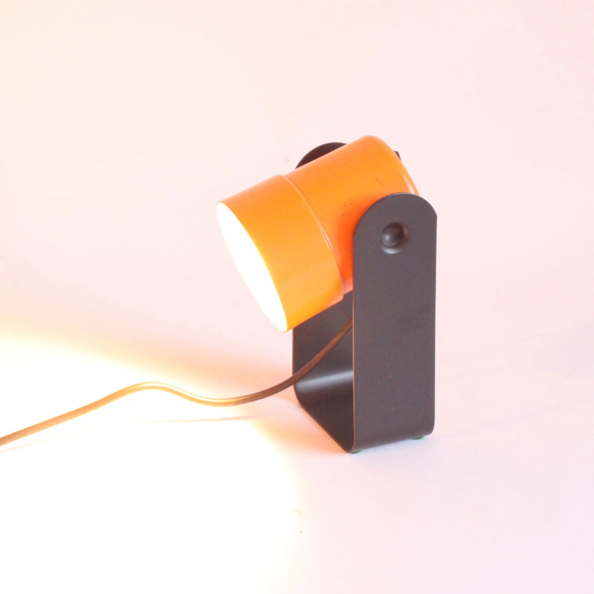 Orange and black table or wall spotlight lamp by Karl Lang for SIS Leuchten, Germany 1976. Model 881, won a I.F. or "internation forum" award in 1976 | Century Soup |