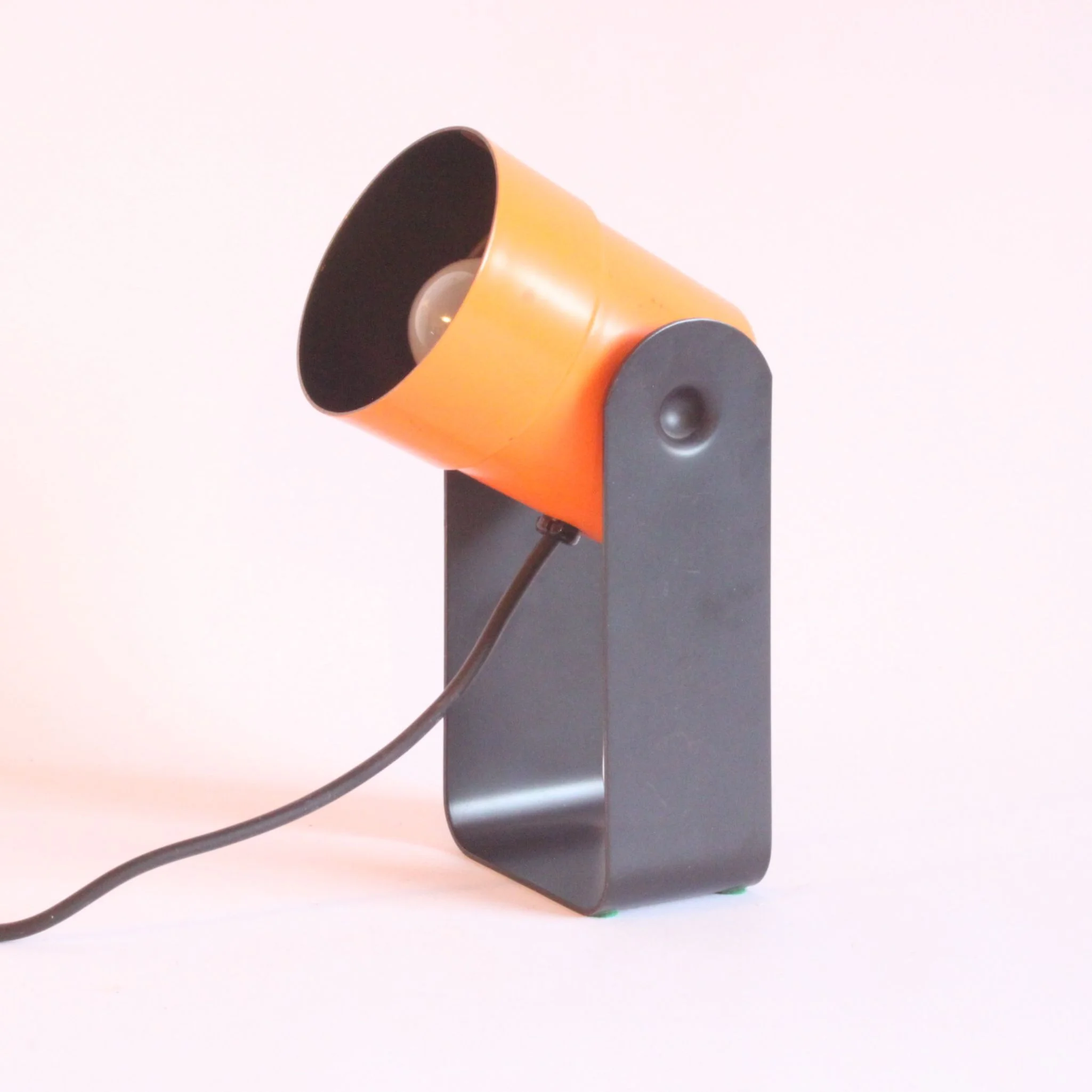 Orange and black table or wall spotlight lamp by Karl Lang for SIS Leuchten, Germany 1976. Model 881, won a I.F. or "internation forum" award in 1976 | Century Soup |