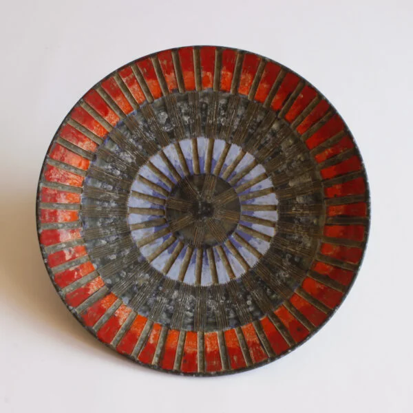 A large round geometric plate in ceramic by Fratelli Fanciullacci, Italy 1960s. Red and blue sgraffito decor pattern to resemble a mosaïc | Century Soup | Vintage italian studio ceramics mid century modern