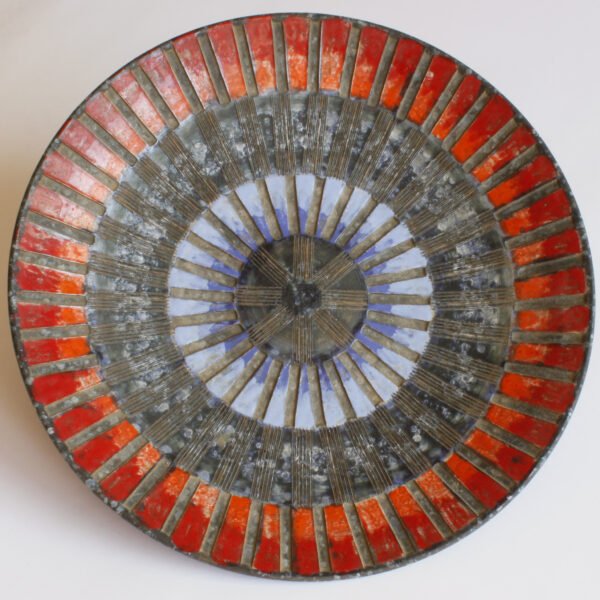 A large round geometric plate in ceramic by Fratelli Fanciullacci, Italy 1960s. Red and blue sgraffito decor pattern to resemble a mosaïc | Century Soup | Vintage italian studio ceramics mid century modern