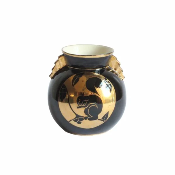 A black and gold decorated art deco vase with a squirrel. Ball shaped with stepped ears in typical art deco style. Designed by Charles Catteau for Boch Keramis, Belgium. Model number D.2137. Century soup vintage design antiques curiosa collectibles antwerp.