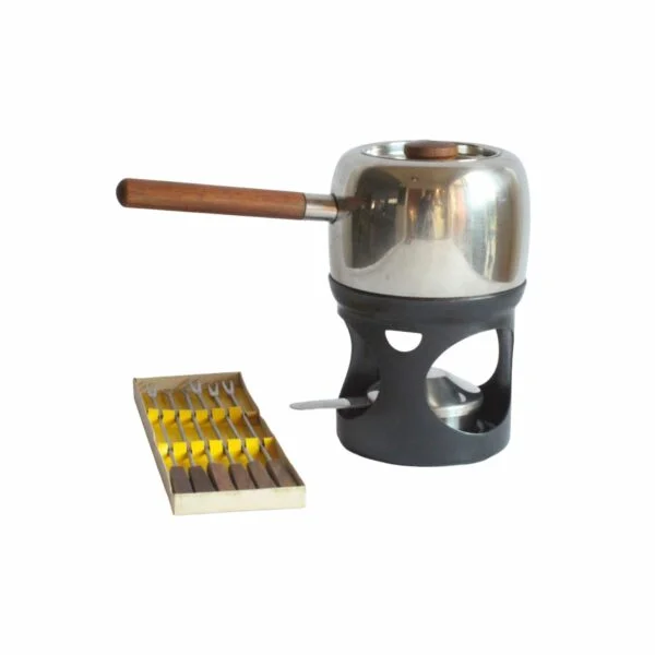 A fondue set by Timo Sarpaneva for Opa Oy, Helsinki. Designed in 1970. The Opa series is part of the collection of the Philadelphia museum of art aswell as the Helsinki design museum. Comes with a set of fondue forks in teak wood. Century soup vintage design antiques curiosa collectibles antwerp.