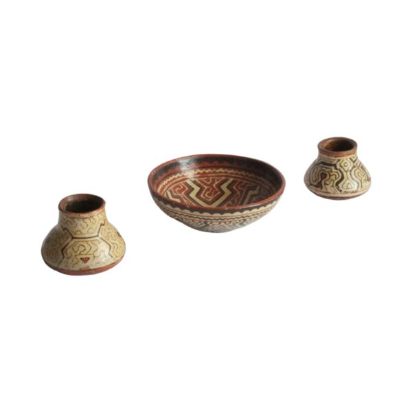 A set of three Shipibo earthenware vessels with intricate geometrical patterns. Almost resembling electronic circuit boards. One bowl and two jars or pots. The Shipibo of the Ucayali River, a southern tributary of the Upper Amazone in Peru, produce some of the finest polychrome prefire slip-painted earthenware pottery in the world. Also notable is that they are one of the few indigenous groups in which the primary artists are women. The Shipibo see and hear these geometric patterns in nature and reproduce the designs on their clothing, face paint, etc... Every design carries its own specific meaning. Century soup vintage design antiques curiosa collectibles antwerp.