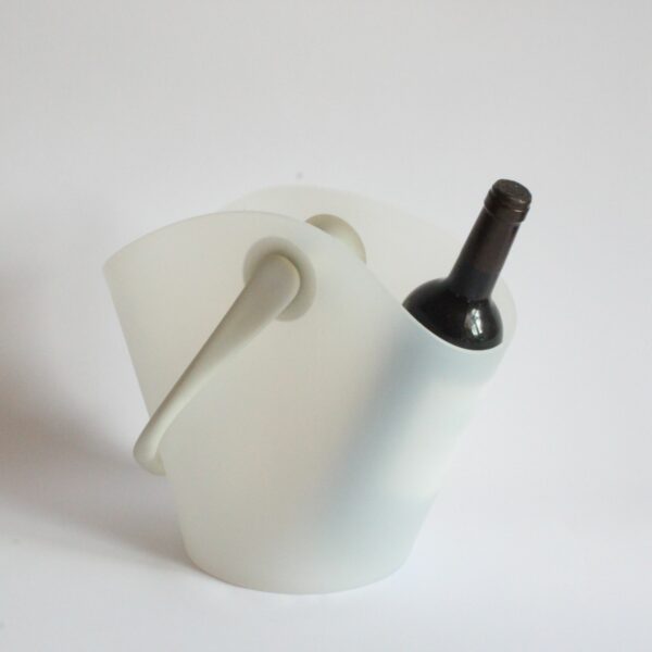 Alessi Chiringuito champagne or wine bottle bucket cooler that hangs from the side of the table. Designed by Ron Arad and Alberto Gozzi for Alessi in 2004. In a white thermoplastic resin. A chiringuito is a typical Spanish semi temporary beach or riverside restaurant or bar. Century soup vintage design antiques curiosa collectibles antwerp.
