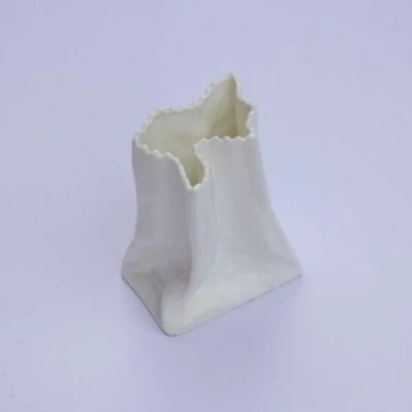 A vintage white paper bag vase in porcelain. Century soup vintage design antiques curiosa collectibles antwerp.