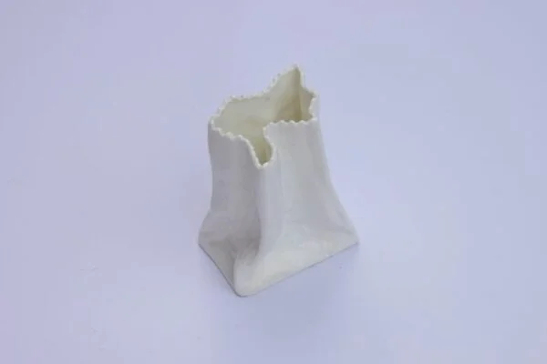A vintage white paper bag vase in porcelain. Century soup vintage design antiques curiosa collectibles antwerp.