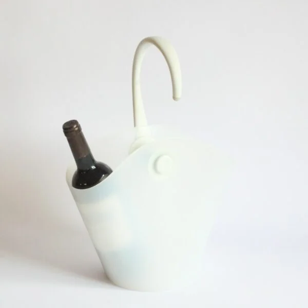 Alessi Chiringuito champagne or wine bottle bucket cooler that hangs from the side of the table. Designed by Ron Arad and Alberto Gozzi for Alessi in 2004. In a white thermoplastic resin. A chiringuito is a typical Spanish semi temporary beach or riverside restaurant or bar. Century soup vintage design antiques curiosa collectibles antwerp.