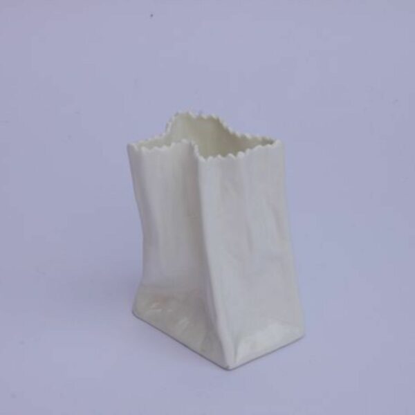 A vintage white paper bag vase in porcelain. Century soup vintage design antiques curiosa collectibles antwerp.