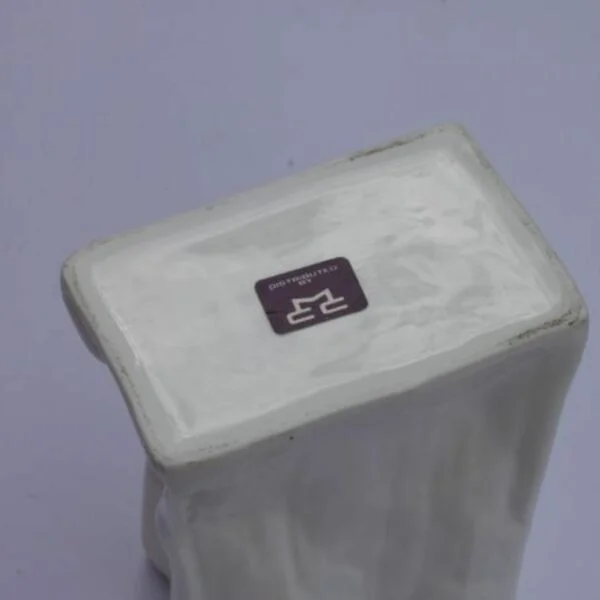 A vintage white paper bag vase in porcelain. Century soup vintage design antiques curiosa collectibles antwerp.
