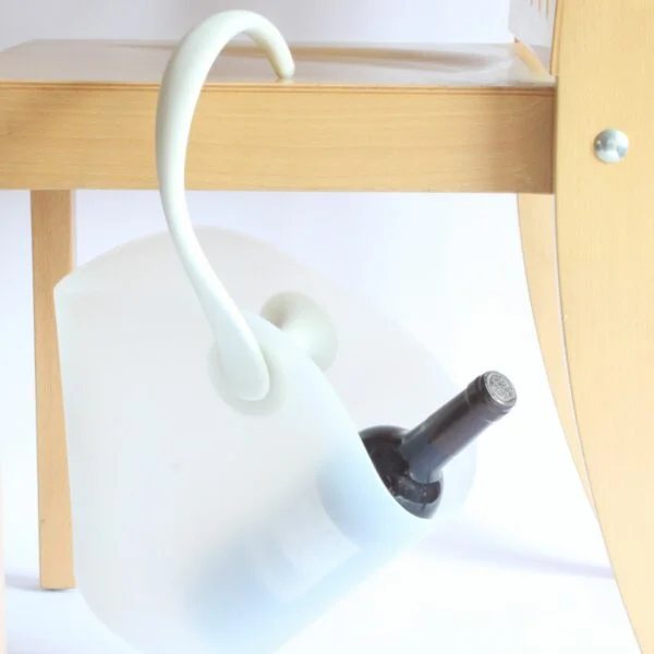 Alessi Chiringuito champagne or wine bottle bucket cooler that hangs from the side of the table. Designed by Ron Arad and Alberto Gozzi for Alessi in 2004. In a white thermoplastic resin. A chiringuito is a typical Spanish semi temporary beach or riverside restaurant or bar. Century soup vintage design antiques curiosa collectibles antwerp.