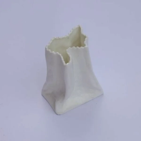 A vintage white paper bag vase in porcelain. Century soup vintage design antiques curiosa collectibles antwerp.