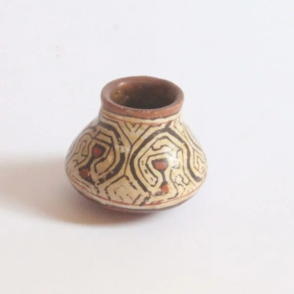A set of three Shipibo earthenware vessels with intricate geometrical patterns. Almost resembling electronic circuit boards. One bowl and two jars or pots. The Shipibo of the Ucayali River, a southern tributary of the Upper Amazone in Peru, produce some of the finest polychrome prefire slip-painted earthenware pottery in the world. Also notable is that they are one of the few indigenous groups in which the primary artists are women. The Shipibo see and hear these geometric patterns in nature and reproduce the designs on their clothing, face paint, etc... Every design carries its own specific meaning. Century soup vintage design antiques curiosa collectibles antwerp.
