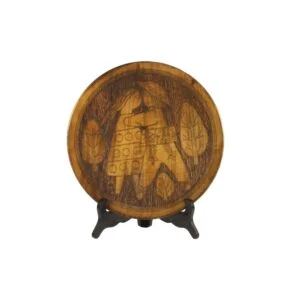 A Scandinavian style carved wooden plate with figures, 1960s - 1970s. Copper inlay outlines the leaves, symbols and figures. Depicting a hippie couple kissing, stylized modernistic. The background seems to be darkened by a hot needle. Dimensions: 28.5cm x 4cm Century soup vintage design antiques curiosa collectibles antwerp.