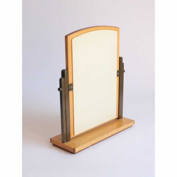 Art deco style dealers boutique mirror to try on Omega watches in the store. Made in Switzerland 1940s. Base and frame in marquetry with two kinds of wood. And two brass art deco shaped arms to hold the swiveling mirror. Century soup vintage design antiques curiosa collectibles antwerp.